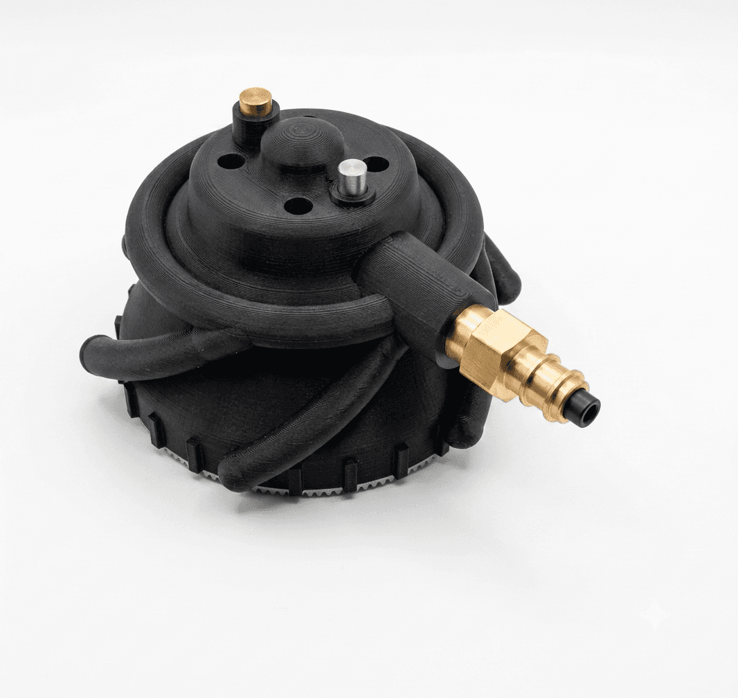 3D-printed PA6-CF vortex gripper body with a brass G 1/8-inch fitting and external spiral air channels